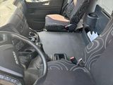a picture of the inside of a vehicle with a steering wheel