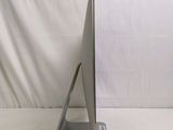 a silver computer on a stand on a white background