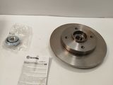 a brake disc and a nut on a white table