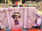 a pink bag with a picture of a dog on it
