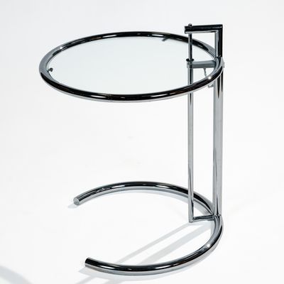 chrome and glass side table with curved legs and a glass top
