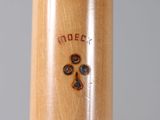 a close up of a baseball bat with a cross on it