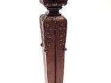 a small wooden object that is sitting on a table