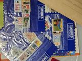 a bag of stamps and stamps on a table