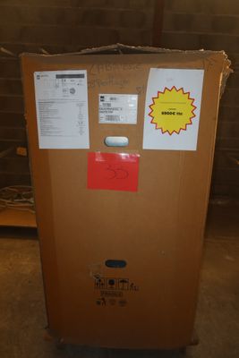 a brown box with stickers on it sitting in a room