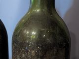 two bottles of wine that are sitting on a table