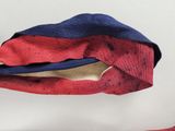 a red and blue bag with a zipper on it