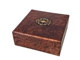 an image of a wooden box with a decorative design on the lid