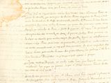 an old document with a piece of paper on top of it