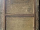 an old window with a wooden frame on a black background