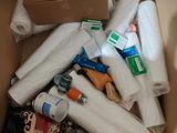 a cardboard box full of toilet paper and other items