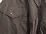 black pants hanging on a hanger in a room