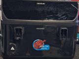 a black cooler sitting on top of a counter