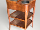 a wooden table with a marble top on it