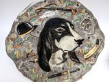 painting of a dog ' s face on a decorative plate