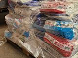 a pile of toothbrushes sitting on a pallet in a warehouse