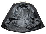 the back of a black jacket hanging on a wooden hanger