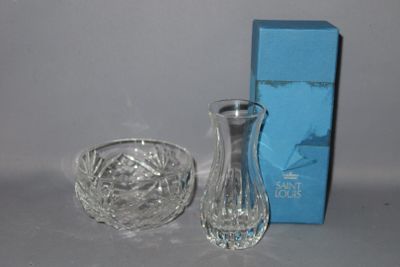 a glass vase and a glass bowl on a table