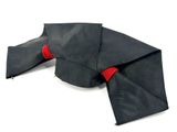 a black umbrella with red trims on a white surface