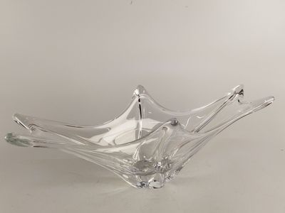 clear glass bowl sitting on a table with a white background