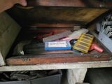 a wooden box with a bunch of tools inside of it