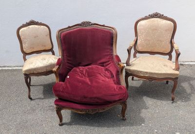 three chairs that are sitting next to each other