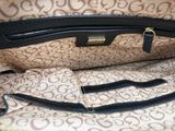 a close up of a purse with a handle on it
