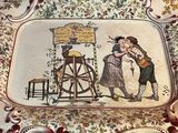 a plate with a picture of a man and a woman on it