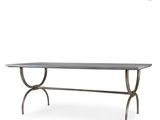 the table is made of metal and has a glass top