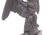a statue of an eagle on a marble base