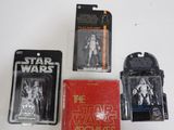 several star wars action figures are displayed on a white surface