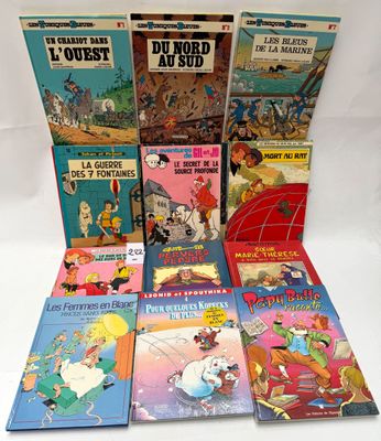 several children ' s books are lined up on a white surface