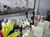 a shelf with a lot of glasses and plates on it