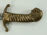 a gold sword with a lion head on it