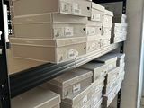 a lot of boxes that are stacked on a shelf