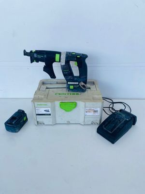 a couple of tools sitting on top of a box on top of a table