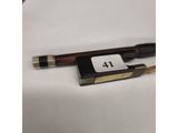 a pen sitting on top of a white table next to a pen