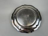 a silver plate that is sitting on a table