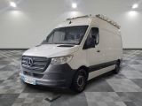 a white van that is parked on a checkered floor