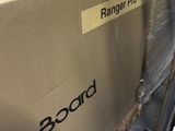 a large box on the back of a conveyor belt in a warehouse