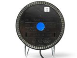 a black clock with a blue button sitting on a stand