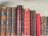 many old books on a shelf in a room