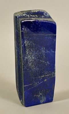 rectangular shaped blue stone object on a white background