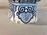 a blue and white bowl sitting on a table