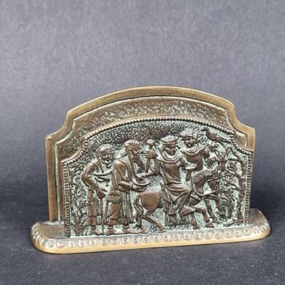 an image of a bronze figurine of a group of people