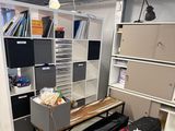 a room with a lot of books on the shelves