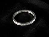 a ring that is laying on top of a black cloth