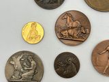 a lot of coins that are sitting on a table