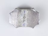 an image of a piece of metal on a white surface
