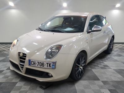 a picture of a white alfa car in a showroom